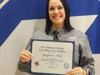 Vest graduates police academy