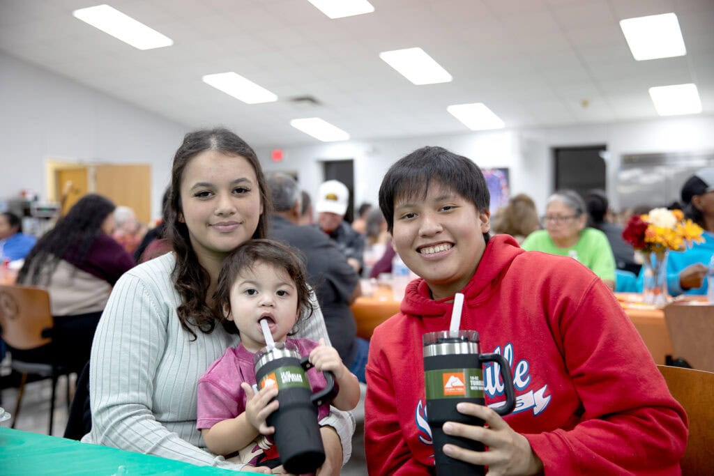 Family smile for a photo.