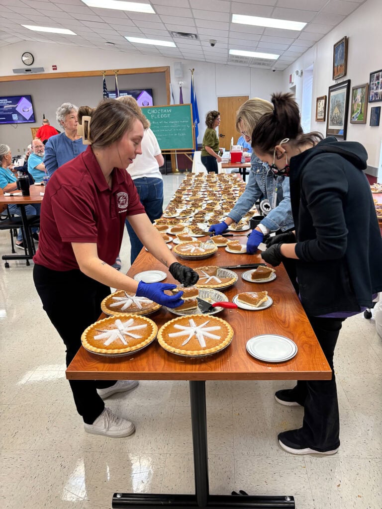 Volunteers prepare desserts.
