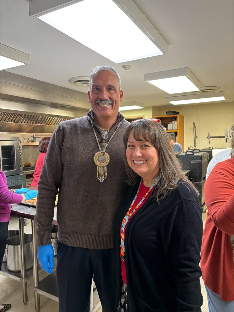 Assistant Chief and Jennifer Turner pose for a photo.