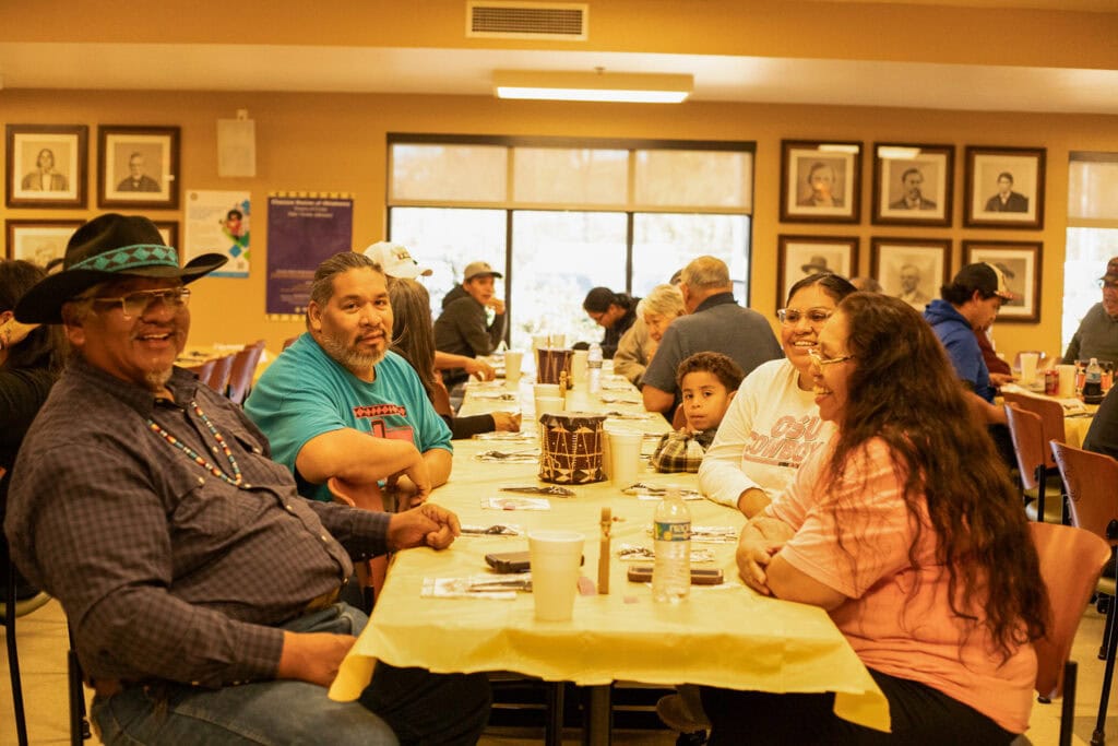 A family sits at a table.