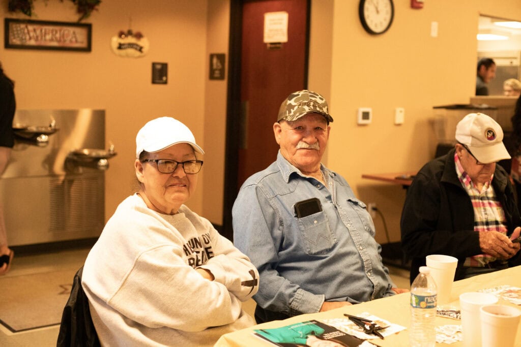 Community members pose for a photo.