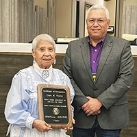 A man and a woman pose for a photo.