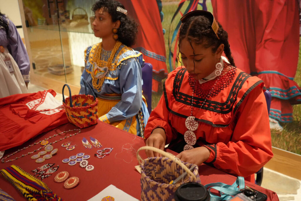 Basket weaving is demonstrated.