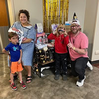 A family poses for a photo.