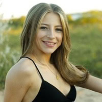 A young woman poses for a photo.