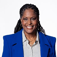 A woman poses for a photo.