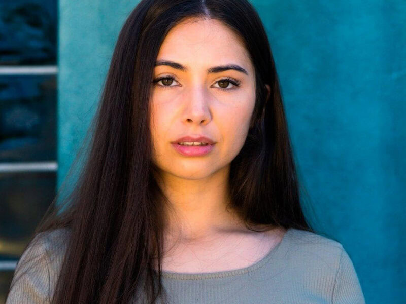 A woman poses for a photo.