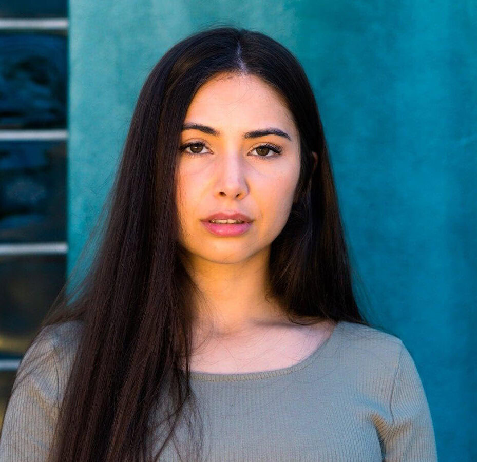 A woman poses for a photo.