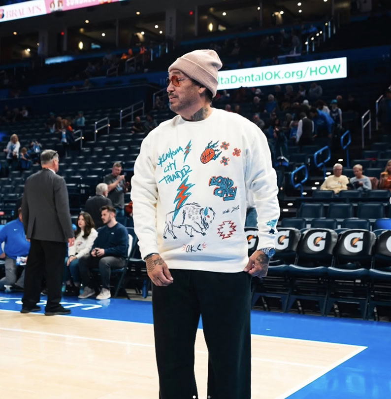 A man walks across a basketball court