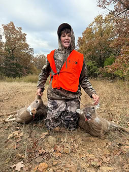 A young man poses with his harvest.