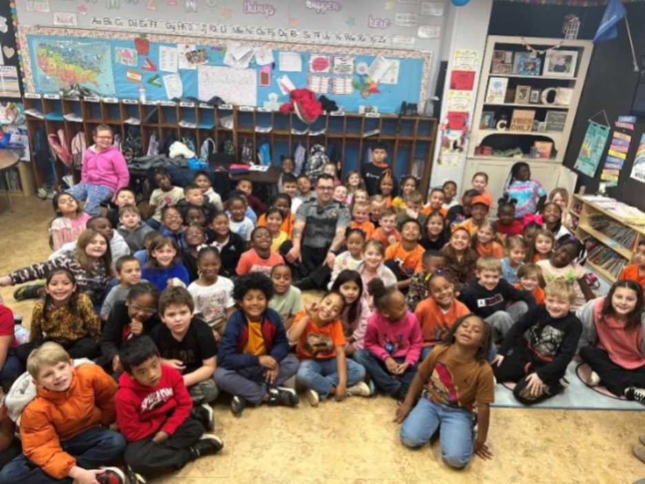 A group of children pose for a photo.