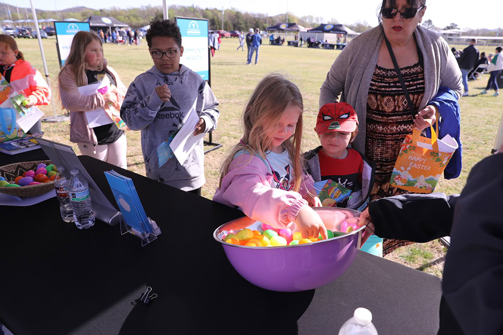 Kids get candy for a services booth