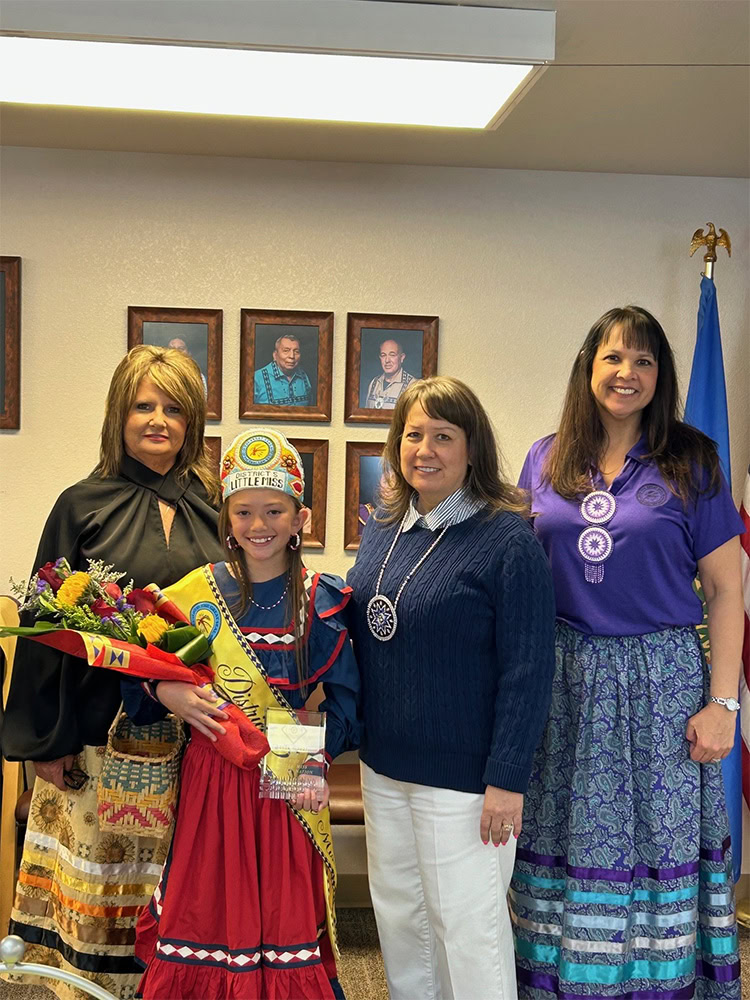 Three women and a little miss princess.