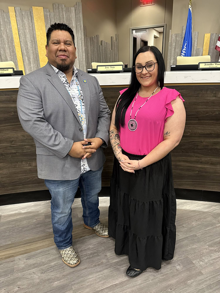 Two people pose for a photo. 
