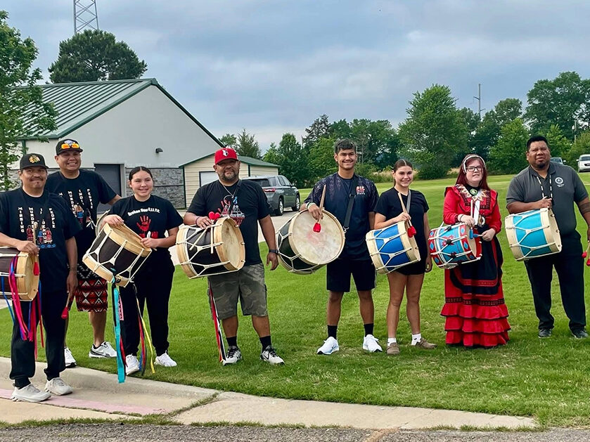 a group of people with Native drums.