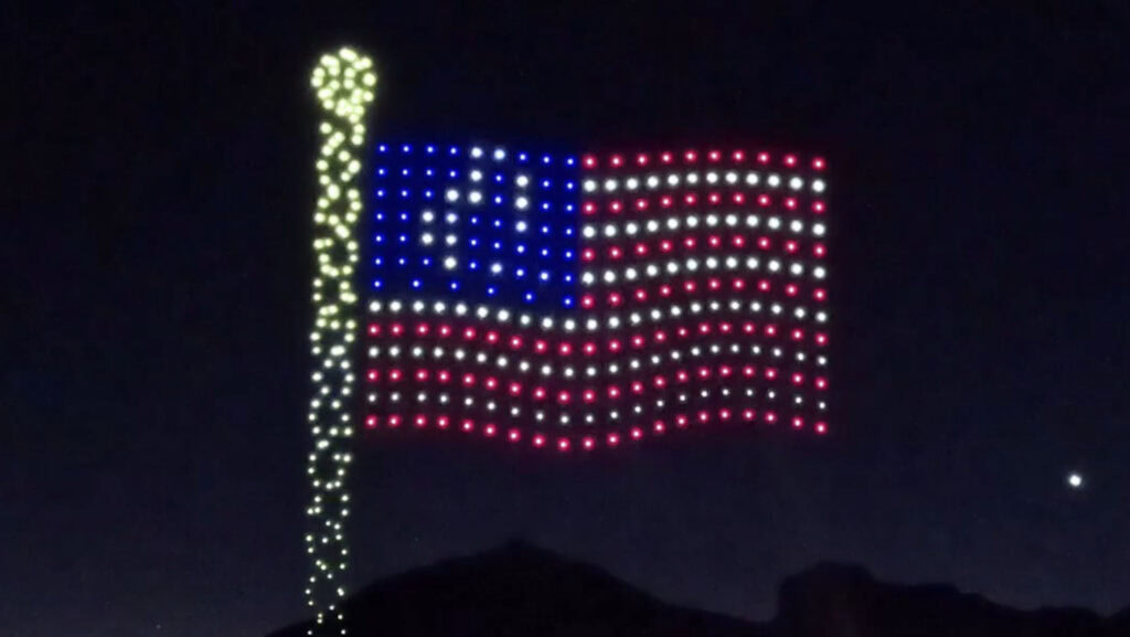 The US flag made from lights on a drone.