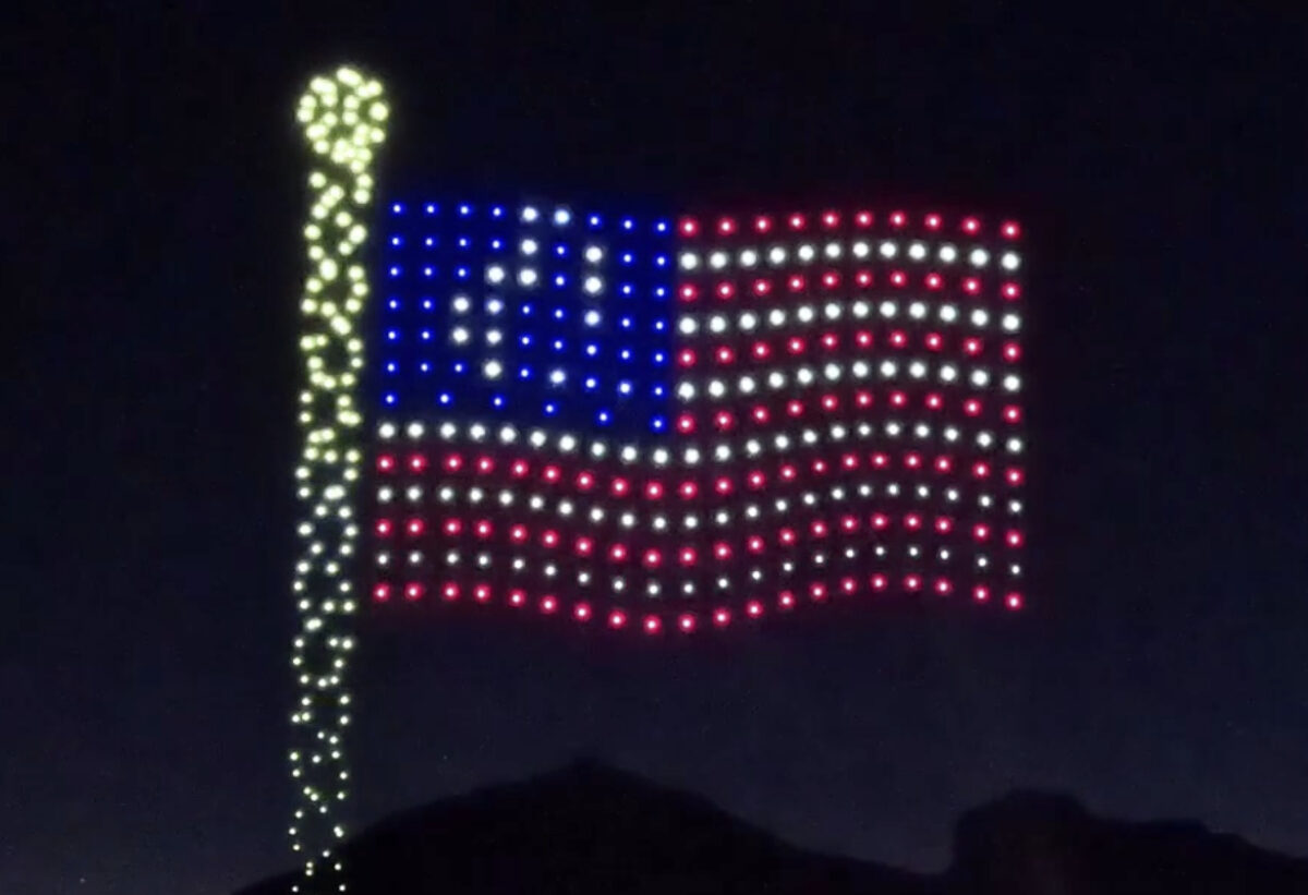 The US flag made from lights on a drone.