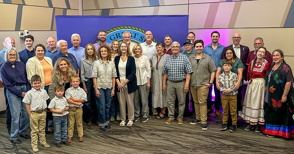 A large group of people pose for a photo.