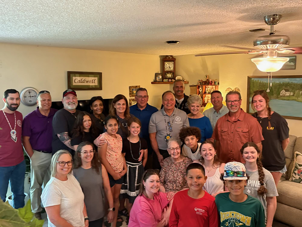 A large group of people pose for a photo.