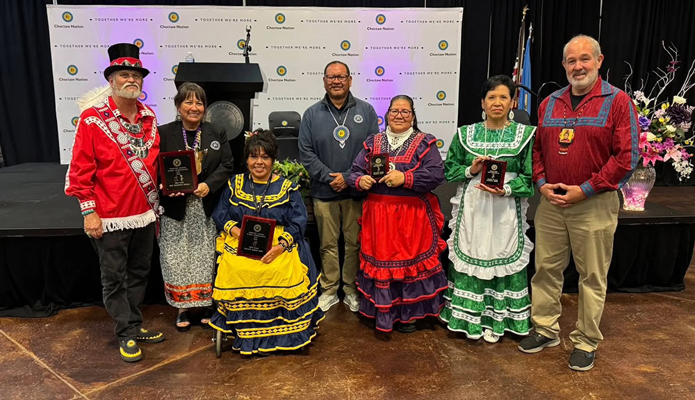 A group of people pose for a photo.
