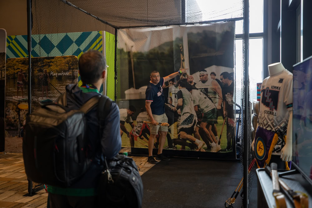 Visitor viewing Choctaw cultural display at FIFA World Cup event.