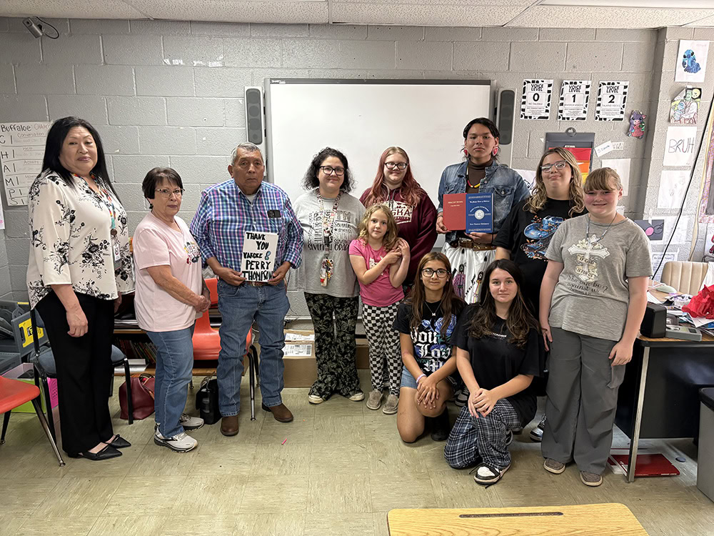 The Hugo Middle School Heritage Club poses for a photo with Councilman Perry Thompson.