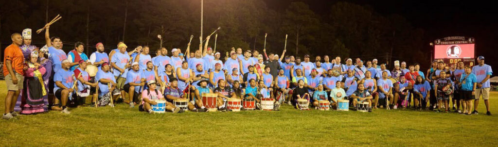 Tvshka Homma 35 and Older poses for a photo on the field. 