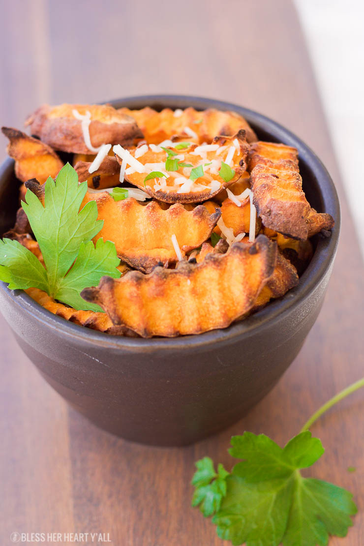 These baked parmesan sweet potato fries are amazingly easy to make with simple ingredients. The hints of savory garlic and parmesan blend perfectly with the sweetness of the sweet potato pieces!