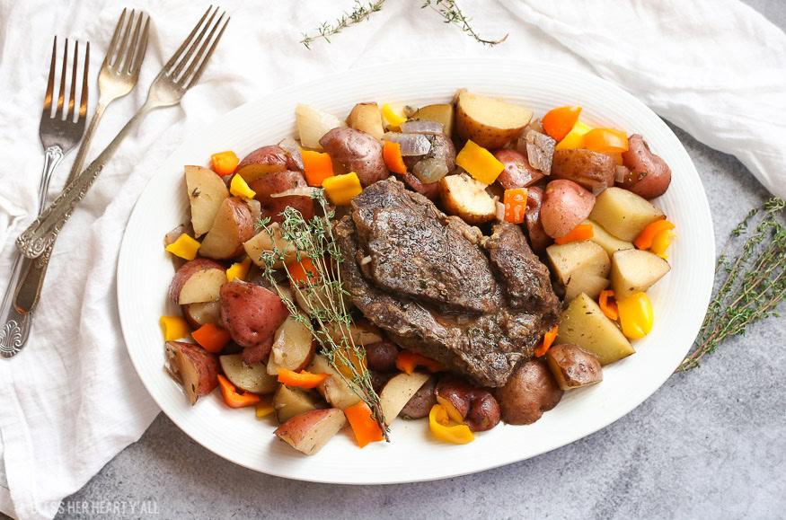 A summer slow cooker pot roast slowly simmers a generous beef roast with hearty potatoes and summer's fresh vegetables in a broth swimming with garlic, onion, thyme, and oregano. Keep cool and let your crock pot do all the hard work!