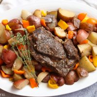 A summer slow cooker pot roast slowly simmers a generous beef roast with hearty potatoes and summer's fresh vegetables in a broth swimming with garlic, onion, thyme, and oregano. Keep cool and let your crock pot do all the hard work!