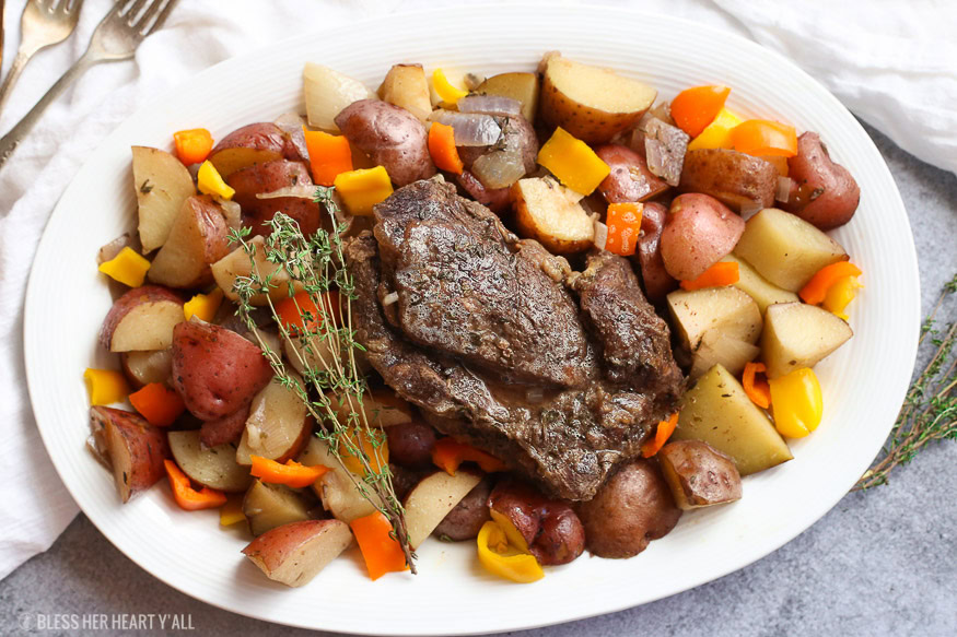 A summer slow cooker pot roast slowly simmers a generous beef roast with hearty potatoes and summer's fresh vegetables in a broth swimming with garlic, onion, thyme, and oregano. Keep cool and let your crock pot do all the hard work!