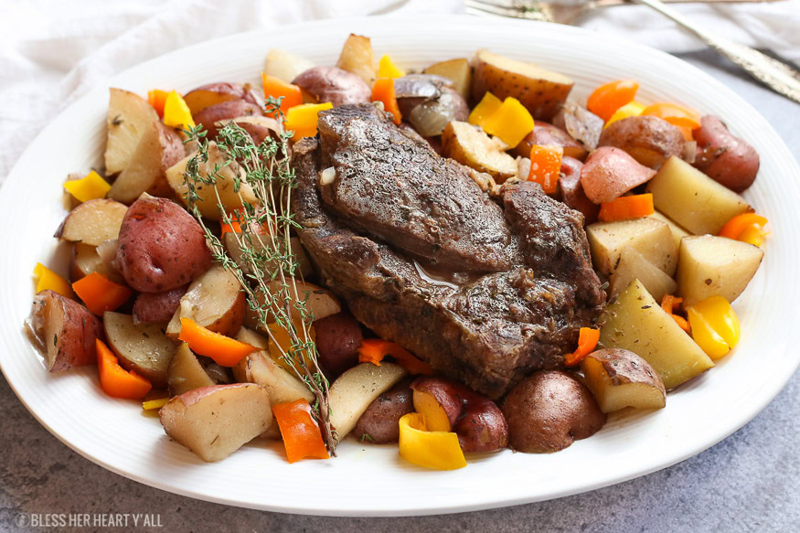 A summer slow cooker pot roast slowly simmers a generous beef roast with hearty potatoes and summer's fresh vegetables in a broth swimming with garlic, onion, thyme, and oregano. Keep cool and let your crock pot do all the hard work!