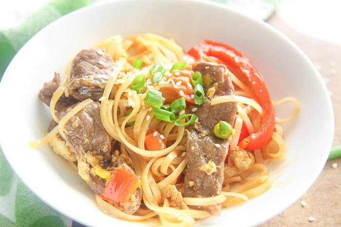 beef pad thai with green onion slivers