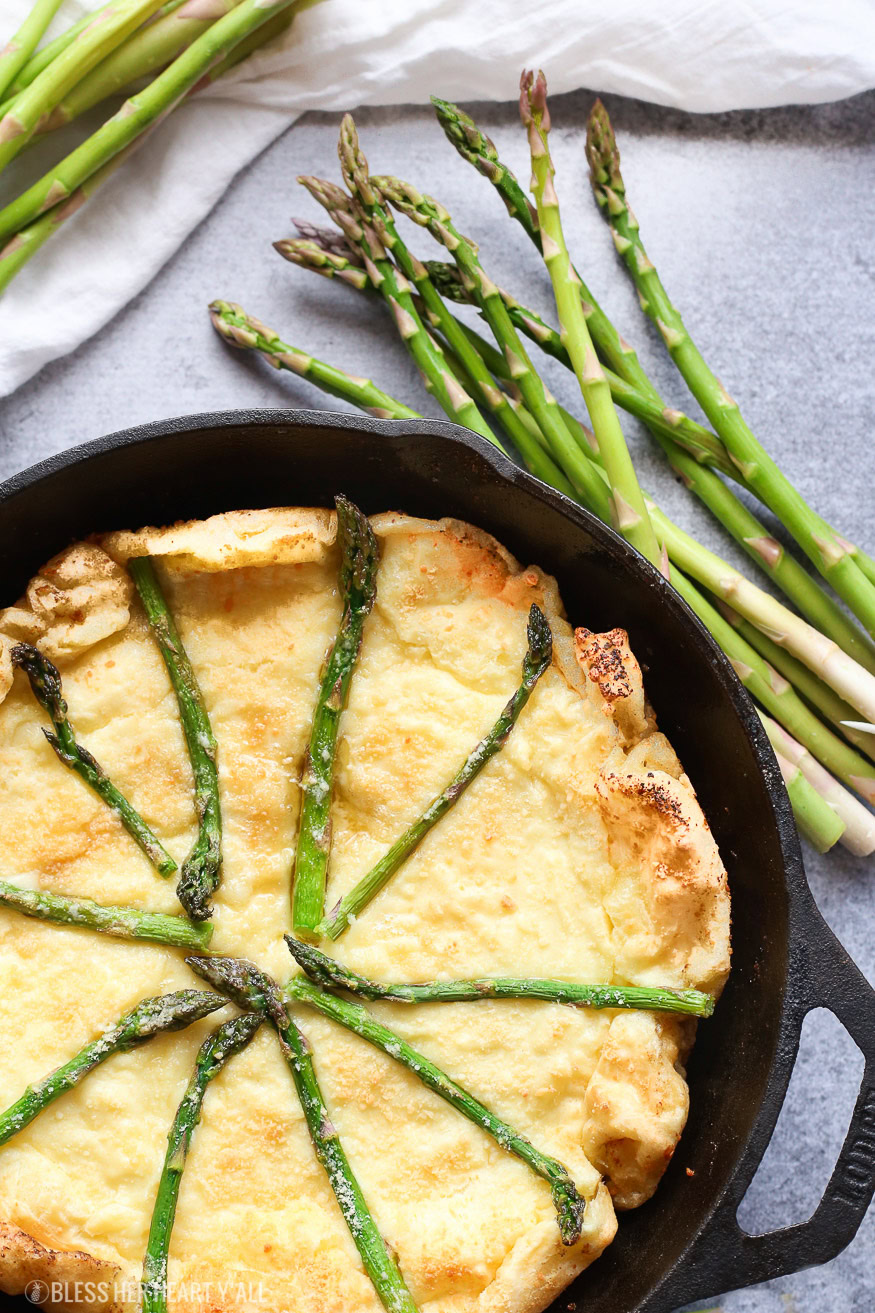 gluten free swiss asparagus dutch baby is the most moist, smooth, doughy and cheesy dutch baby and so easy to make! Just bake for 12-15 minutes!