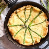 gluten free swiss asparagus dutch baby is the most moist, smooth, doughy and cheesy dutch baby and so easy to make! Just bake for 12-15 minutes!