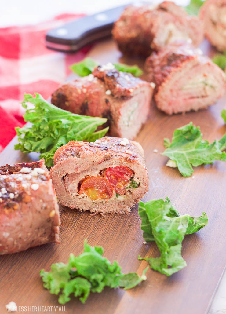 These grilled spicy steak pinwheels use a mixture of cotija cheese, grape tomatoes, pepper flakes, and arugula leaves all wrapped up in some yummy thinly-sliced steak. The drooling starts now! www.BlessHerHeartYall.com