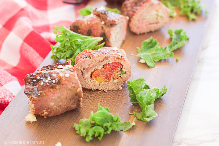 These grilled spicy steak pinwheels use a mixture of cotija cheese, grape tomatoes, pepper flakes, and arugula leaves all wrapped up in some yummy thinly-sliced steak. The drooling starts now! www.BlessHerHeartYall.com