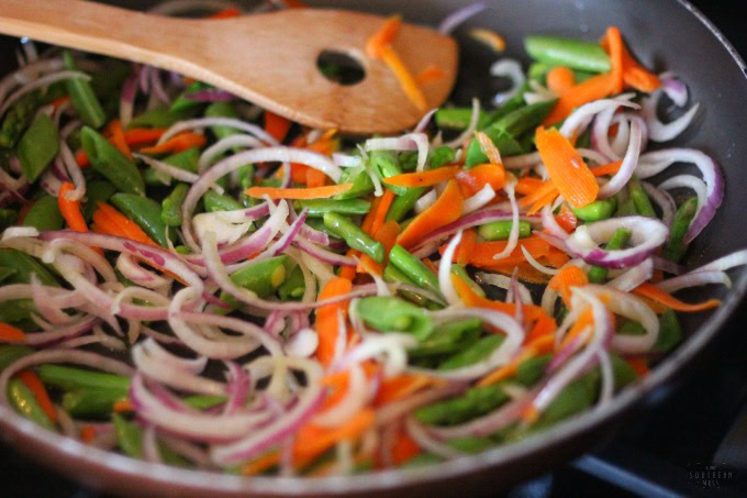 sweet and spicy summer garden vegetable pasta vegetables in skillet