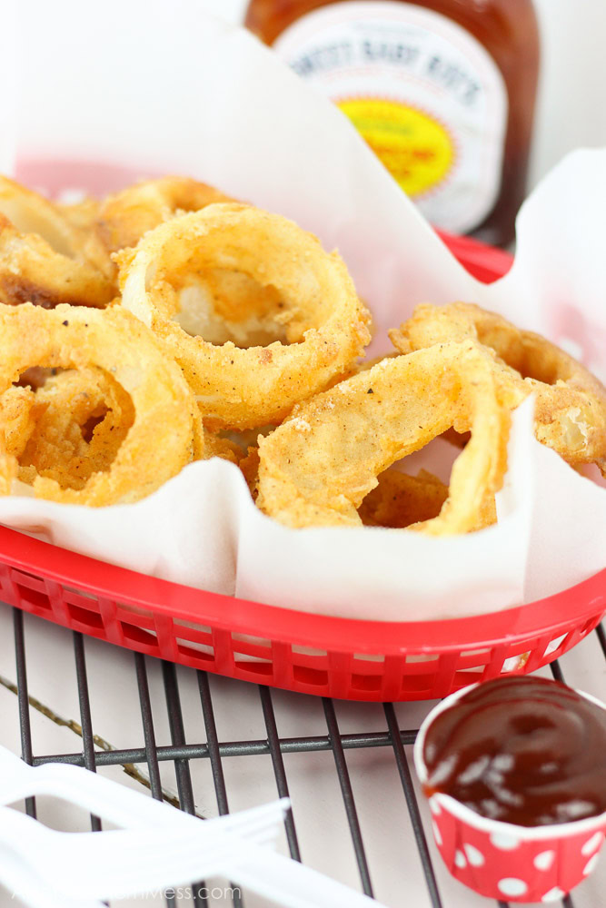 Crunchy, crispy, and barbecue-y! These BBQ and Buttermilk Onion Rings are easily made at home with just a few simple ingredients and in only minutes! www.ahotsouthernmess.com