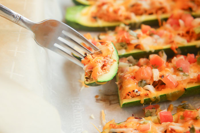 slice of chicken taco zucchini boat on fork