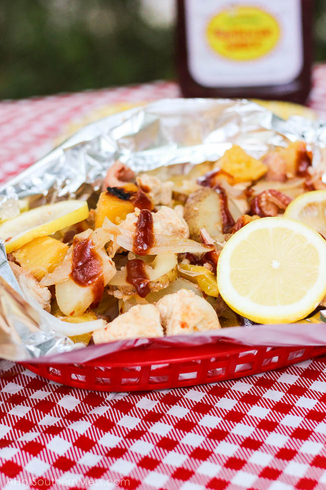 Juicy grilled chicken is paired with fresh pineapple, lemon, sweet onion, and potatoes, drizzled with sweet bbq sauce and some extra spice, and then slipped into some tin foil and kissed on the grill. There's no mess to clean up with this all-in-one meal, no dish that got dirty, and likely no leftovers because frankly, it is just that damn good. www.ahotsouthernmess.com