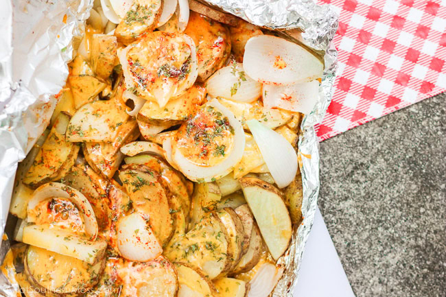 Ooey gooey melty cheesy with no strings attached {as in no dirty dishes to clean!}. What else do I gotta say? {She drops her mic, brushes her hands off, turns around and walks away}. These simple and tasty potato slices are tossed in a layer of cheeses and sweet onion, sprinkled in paprika, parsley, and some “heat”, loaded onto some tin foil and kissed on the grill till tender, crispy on the outside, and melty everywhere else. If stringy melty cheese gets to your heart, you will fall in love with these easy sizzlin’ campfire taters. www.ahotsouthernmess.com