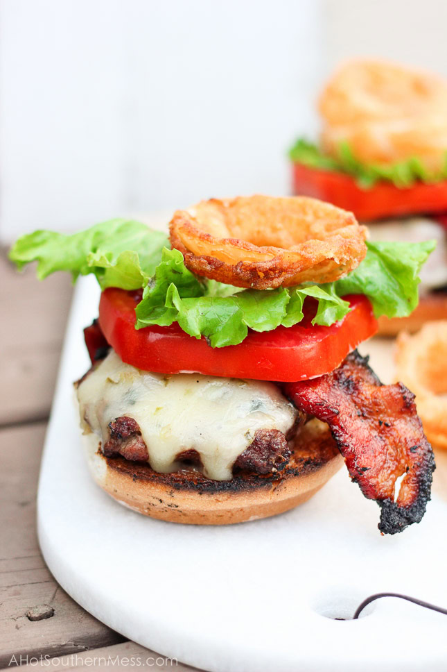 Oh my gosh, this burger looks so good! I have got to try it! Ooey gooey pepper jack cheese is stuffed inside juicy ground beef patties along with fresh bites of crisp spicy jalapeños. The burgers are kissed on the grill long enough to cook to your liking and then stacked on top of a fluffy bun, and then loaded with fresh crisp slices of lettuce and tomato, BBQ bacon, and homemade buttermilk onion rings. www.ahotsouthernmess.com