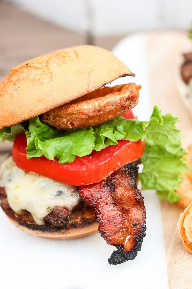 Oh my gosh, this burger looks so good! I have got to try it! Ooey gooey pepper jack cheese is stuffed inside juicy ground beef patties along with fresh bites of crisp spicy jalapeños. The burgers are kissed on the grill long enough to cook to your liking and then stacked on top of a fluffy bun, and then loaded with fresh crisp slices of lettuce and tomato, BBQ bacon, and homemade buttermilk onion rings. www.ahotsouthernmess.com