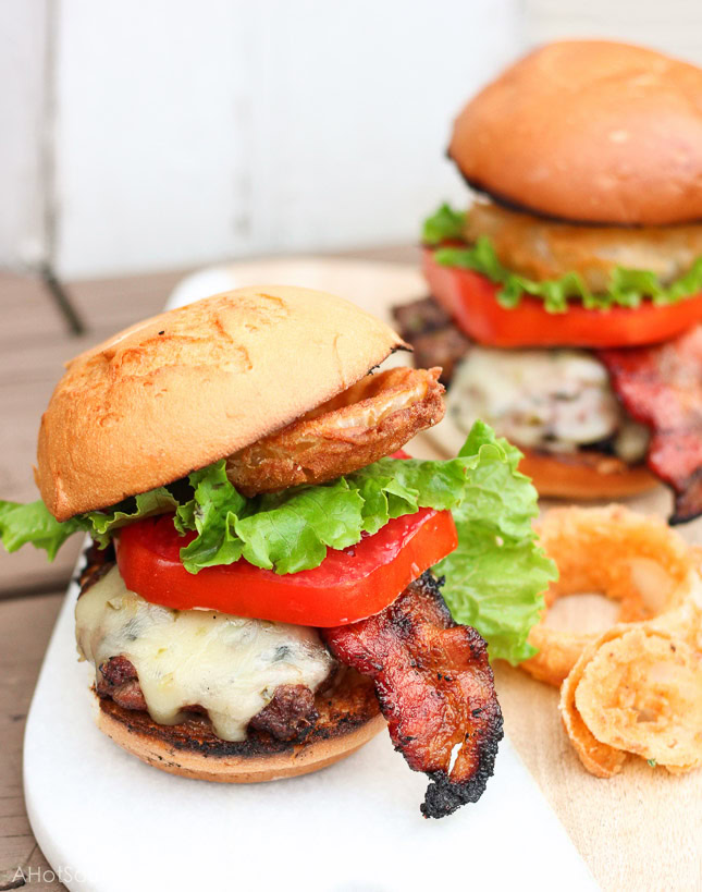 Oh my gosh, this burger looks so good! I have got to try it! Ooey gooey pepper jack cheese is stuffed inside juicy ground beef patties along with fresh bites of crisp spicy jalapeños. The burgers are kissed on the grill long enough to cook to your liking and then stacked on top of a fluffy bun, and then loaded with fresh crisp slices of lettuce and tomato, BBQ bacon, and homemade buttermilk onion rings. www.ahotsouthernmess.com