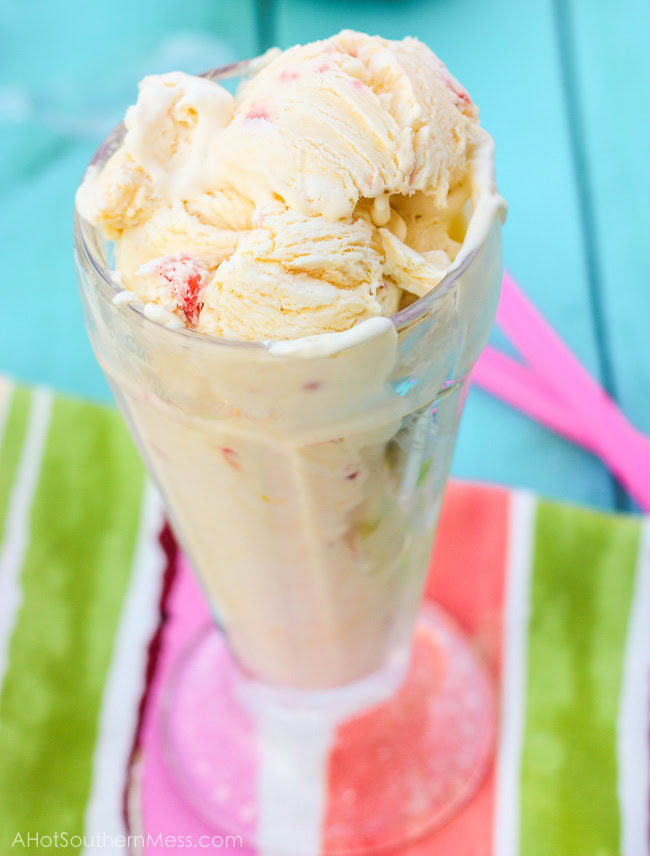 Fresh creamy strawberry mango ice cream with hand picked strawberry pieces and puréed mango folded in. Ten minutes of prep work and just a hand mixer is all that you need to prepare this light, sweet, refreshing treat for those long dog days of summer! www.ahotsouthernmess.com