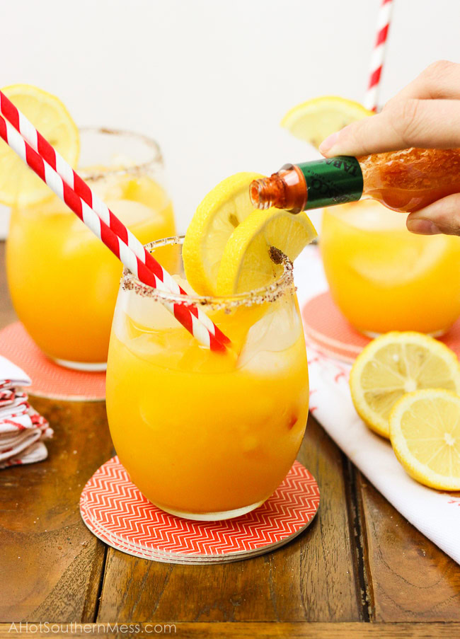 A sweet refreshing twist on summer lemonade. The fusion of mango and chili powder along with a splash of hot sauce, add a fun spicy summer twist {oh, and did I forget to mention the chili powder and sugar-laced rims? How dare me???}. And for those of us 21 or older, the addition of white rum makes this sipping cocktail a fruity delight! www.ahotsouthernmess.com