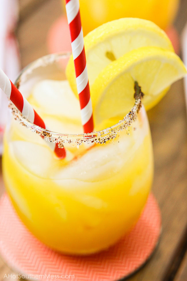 A sweet refreshing twist on summer lemonade. The fusion of mango and chili powder along with a splash of hot sauce, add a fun spicy summer twist {oh, and did I forget to mention the chili powder and sugar-laced rims? How dare me???}. And for those of us 21 or older, the addition of white rum makes this sipping cocktail a fruity delight! www.ahotsouthernmess.com