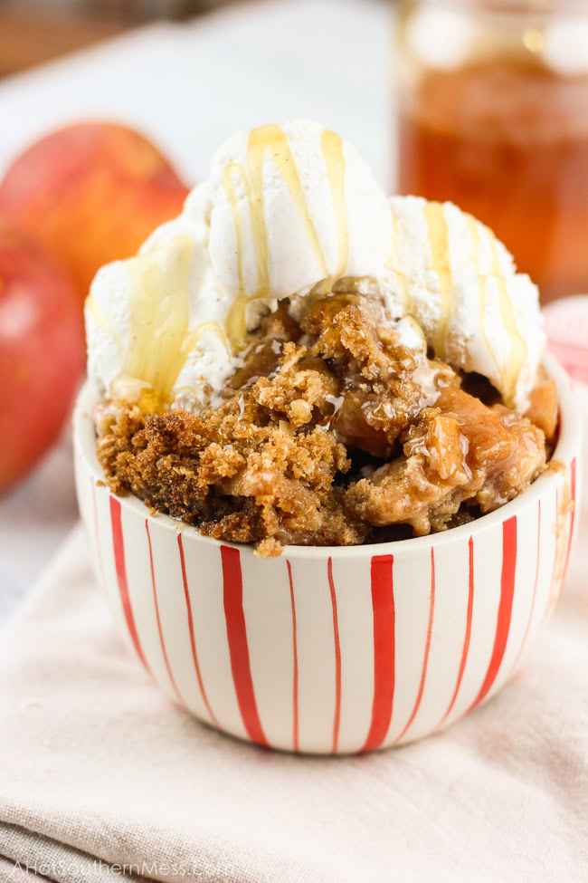 This gluten-free apple crumble is a favorite fall treat. Crisp apples are mixed with sweet end-of-season peaches as a base. Cinnamon, brown sugar, gluten-free oats, and lemon juice are combined with a bit of sweet cream butter, to finish off the candy-like crumble topping. Serve right out of the oven with soft vanilla bean ice cream and a fresh honey drizzle. www.ahotsouthernmess.com